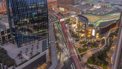 Sticker - Aerial panorama of Downtown Dubai with shopping mall and traffic on a street day to night timelapse from above, UAE