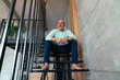 © Westend61 - Thoughtful man sitting on staircase at home
