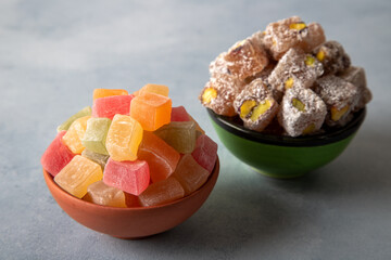 Traditional Turkish delight and pistachio candy in two bowls