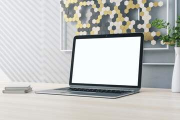 Poster - Close up of creative wooden designer desktop with empty white computer screen and decorative banner. Mock up and 3D Rendering concept.