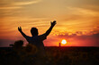 © Ryzhkov Oleksandr - Silhouette of happy successful corn farmer in cornfield in sunset with arms raised in the air