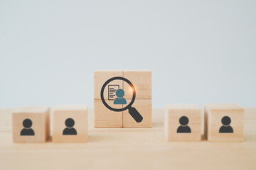 wooden cube blocks with buyer information in magnifying glass ,buyer persona and target customer con