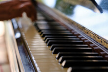 Close Up Of Old Piano Keys And Wood Grains With Sepia Tone