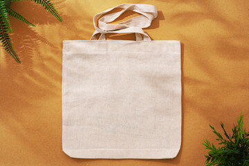 Wall Mural - Textile shopping bag on beige background flat lay