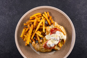 Wall Mural - typical czech cuisine chicken slice baked with ham and camembert with french fries