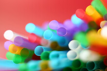 Colorful Blurred Red Background With Many Drinking Straws