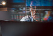 © bignai - Trader wearing eyeglasses working on laptop analyzing online stock market with reflection.