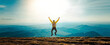 Leinwandbild Motiv Happy man with open arms jumping on the top of mountain - Hiker with backpack celebrating success outdoor - People, success and sport concept