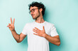 © Asier - Young caucasian man isolated on white background taking an oath, putting hand on chest.