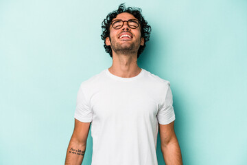 Young caucasian man isolated on white background relaxed and happy laughing, neck stretched showing teeth.