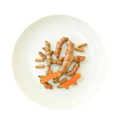 Wall Mural - Turmeric root and capsules in a white ceramic palette.. curcumin is food herb and protect virus C.