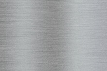 Silver Metal Texture Of Brushed Stainless Steel Plate With The Reflection Of Light.