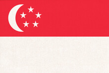 Flag Of Singapore. Singaporean Flag On Fabric Surface. Fabric Texture
