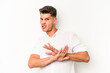 Young caucasian man isolated on white background doing a denial gesture