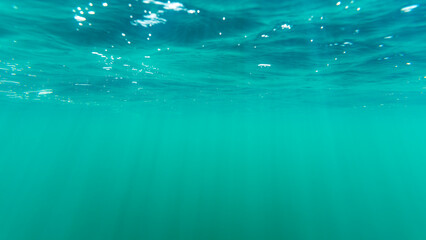 Sun rays through the water surface