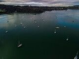 Fototapeta Na sufit - Reflective water flying over Parua Bay marina at sunset in New Zealand's Northland 