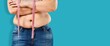 © BillionPhotos.com - Unrecognizable fat plump plus-size overweight woman standing, showing excess naked belly, measuring waist with tape. Dieting, unhealthy food, obesity.