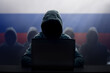 Russian hacker at laptop. Malware and virus.