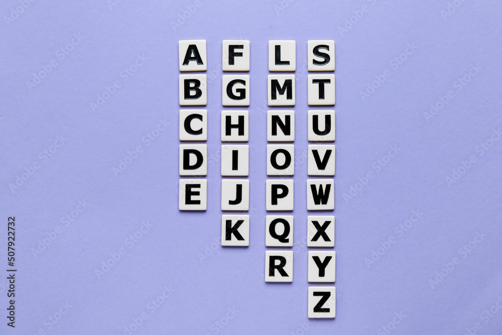 Letters on violet background. Alphabet concept