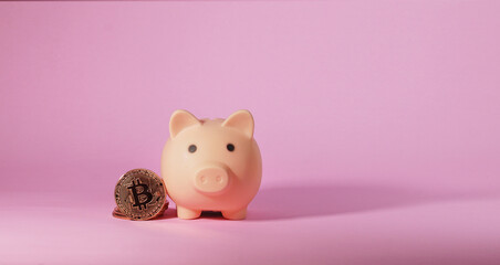 Metal bitcoin and piggy bank. Business and Finance concept..