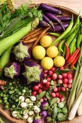 Wall Mural - Organic Southeast Asian vegetables from local farmer market in Thailand, Sustainability concept, Table top view