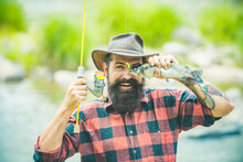 Fishing Hobby And Summer Weekend. Funny Bearded Men Fisher With Fishing Rod And Net. Fish Eye Fun.
