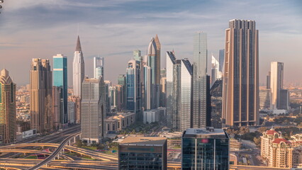 Wall Mural - Panorama of Dubai Financial Center district with tall skyscrapers timelapse.