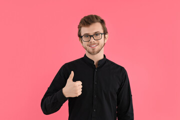 Wall Mural - Concept of people, young man on pink background