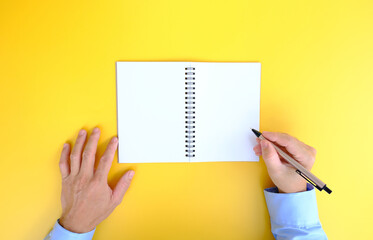 Poster - Office desk with smartphone, laptop computer, cup of coffee, and office tools. Flat lay, top view with copy space. A bank notepad and a pen are on top of an office desk table containing computer tools