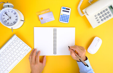 Canvas Print - Male hand holds a pen and signs a paper contract agreement. Concepts of business, lawyer, finance, notary, trading, loan, and accounting