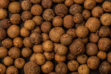 Black pepper, spice close-up flat lay as background. Indian and Arabic spices for cooking. Medicinal herbs and spices.