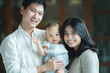 © chokniti - young Asian family are happy together at home by life insurance concept, child baby and mother and father having fun and smile with love, childhood living in cozy lifestyle with dad and mom