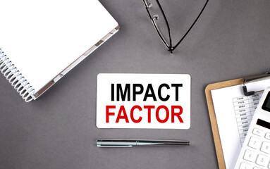 Poster - IMPACT FACTOR text written on card with notebook and clipboard, grey background