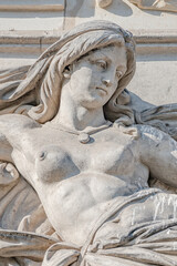 Wall Mural - Old sculpture of a sensual woman warrior, Amazonian, as defender in historical downtown of Dresden, Germany.