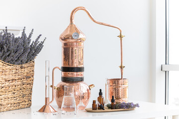 Distillation of lavender essential oil. Copper alambic in a Scandinavian interior. Chemical laboratory