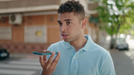 Poster - African american man smiling confident talking on the smartphone at street