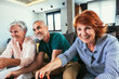 © Mediteraneo - Group of middle age friends smiling happy playing video game at home.
