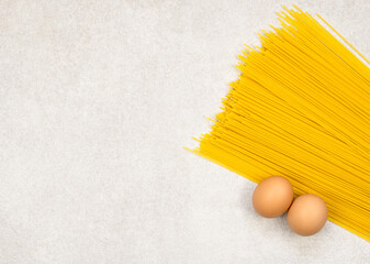 Wall Mural - yellow noodles spaghetti and two eggs