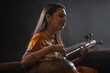 © IndiaPix - Portrait of a female musician performing with Tanpura at concert