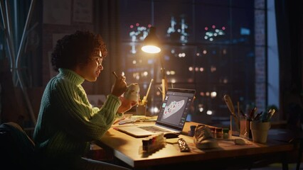 Leinwandbilder - Talented Black Female Artist Working on Colourful Design of Sneakers, During the Evening in Loft Office Studio. Fashion Designer Custom Made Footwear for online Order. Post Production Concept