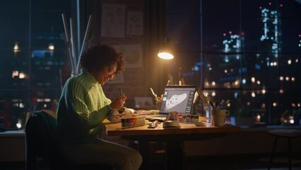 Poster - Millennial Female Artist Creating Trendy Design of Sneakers at her Workspace for Online Sale Exclusive. Black Designer Making Handmade Shoe Late at Evening. Originative People with New Ideas Concept