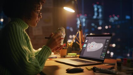 Poster - Millennial Female Artist Creating Trendy Design of Sneakers. Black Designer Making Handmade Shoe Late at Evening. Creative Mess at Workspace. Originative People with New Ideas Concept