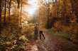 © ADDICTIVE STOCK - Couple standing looking at each other in autumn forest in Canada