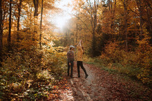Couple Standing Looking At Each Other In Autumn Forest In Canada