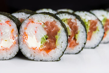 Wall Mural - Closeup of sushi rolls on a white background