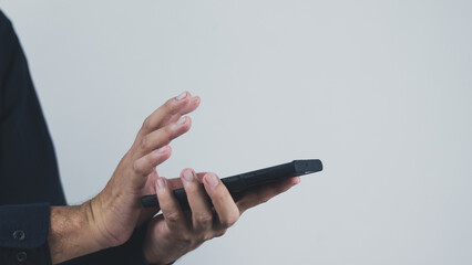 Wall Mural - technology concept social media man using smart phon access online media Through the Internet, there is marketing to answer customer chats. by working at home
