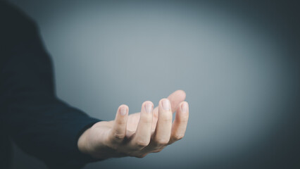 Wall Mural -  man's hand concept The man is spreading his hands at the level of his chest. Suitable for making products, products or symbols to put together with pictures.