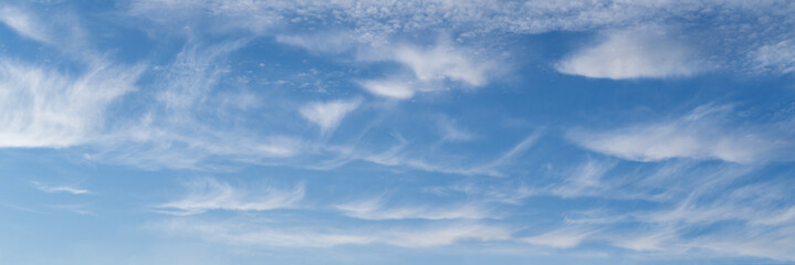 Wall Mural - white clouds in blue summer sky panoramic background