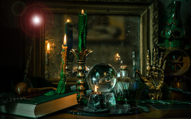 Illustration of magical stuff....candle light, Chrystal ball, magic wand, book of spells dark background, Slytherin school, green aesthetic, Halloween time