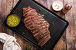 © fahrwasser - Grilled flank steak with chimichurri sauce on a grill pan
